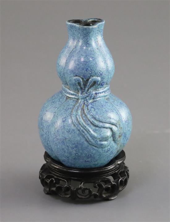 A Chinese robins egg glazed double gourd joss stick holder, 18th/19th century, H. 8.4cm, restored chip, wood stand,